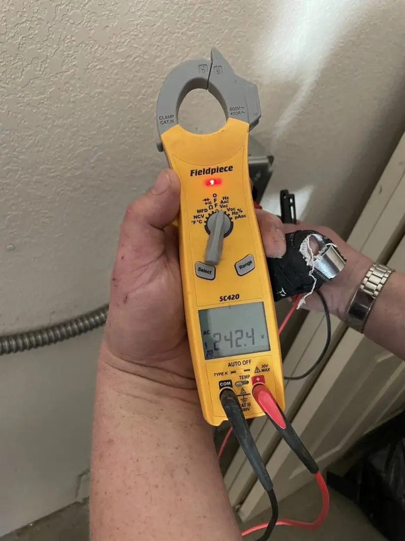 Voltage testing with clamp meter during Outlet Installation in Eldon
